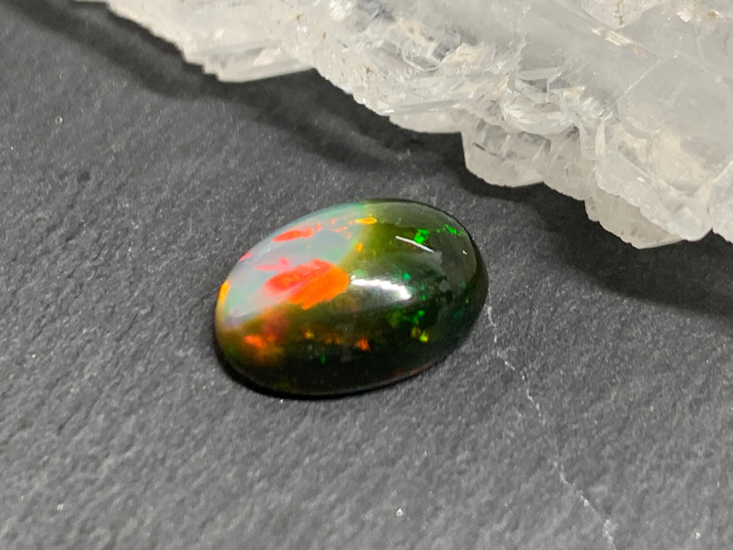 Natural Black Ethiopian Opal oval 8x11x4mm cabochon