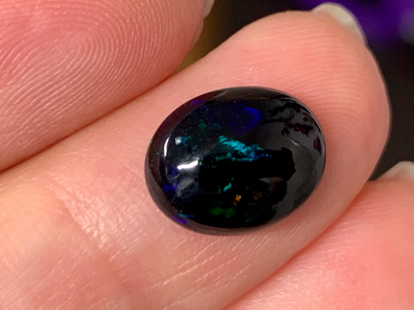 Natural Ethiopian Black Opal 9x11x4mm cabochon