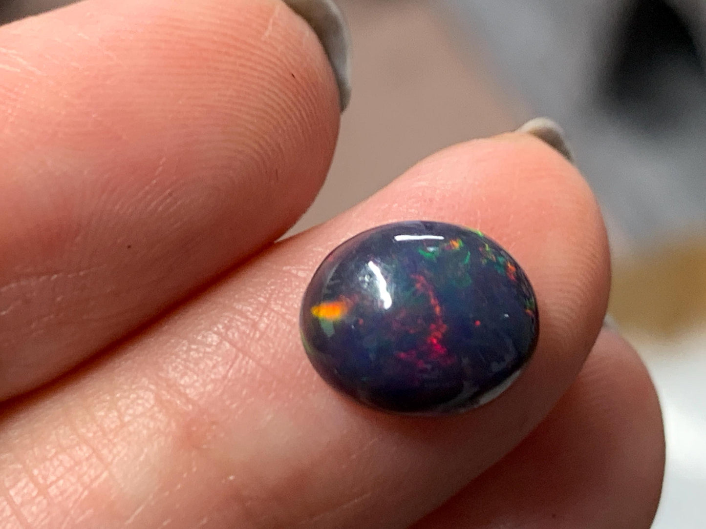 Natural Ethiopian Black Opal 8x11x4mm cabochon