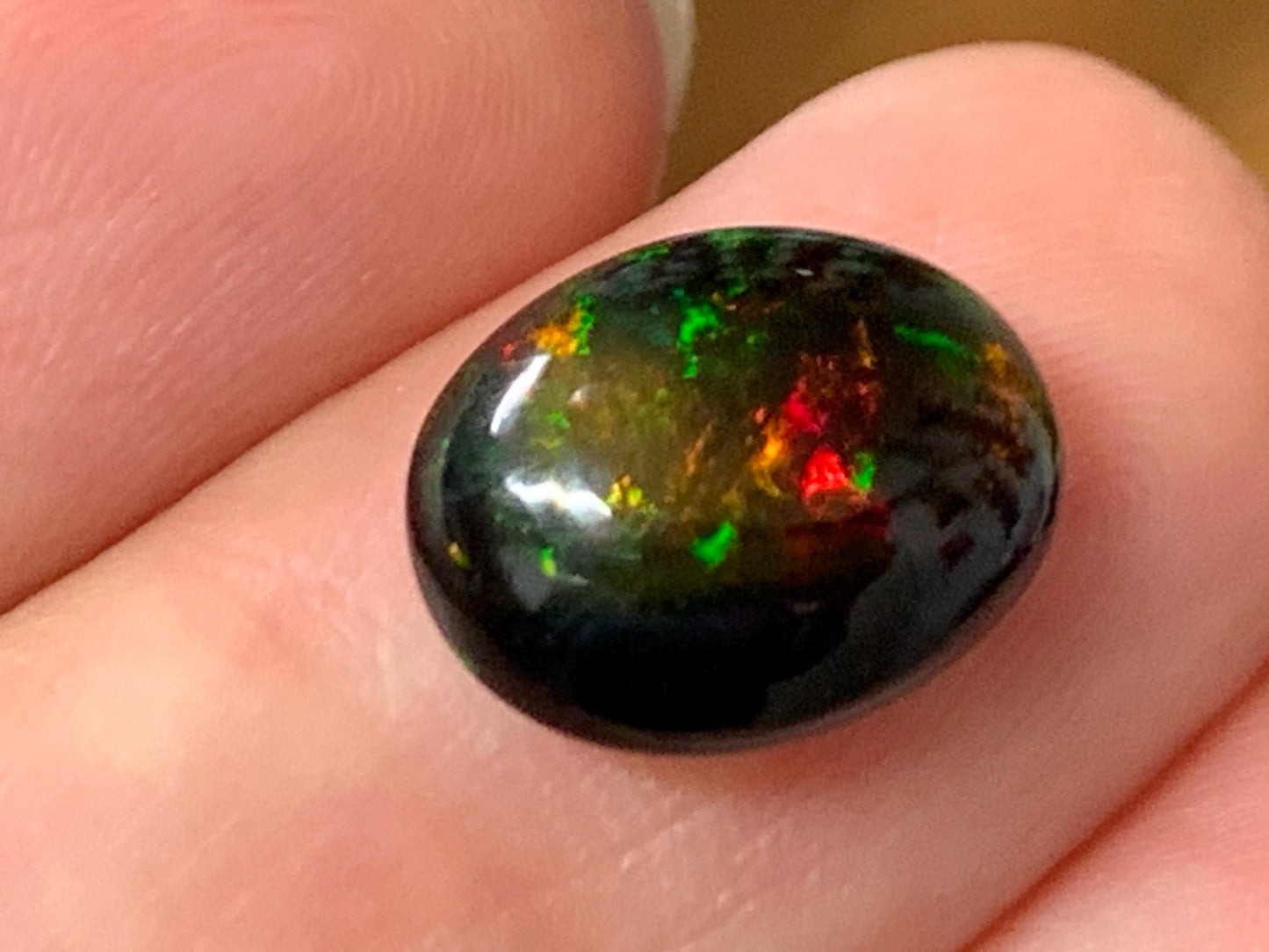 Natural Ethiopian Black Opal 9x12x5mm cabochon