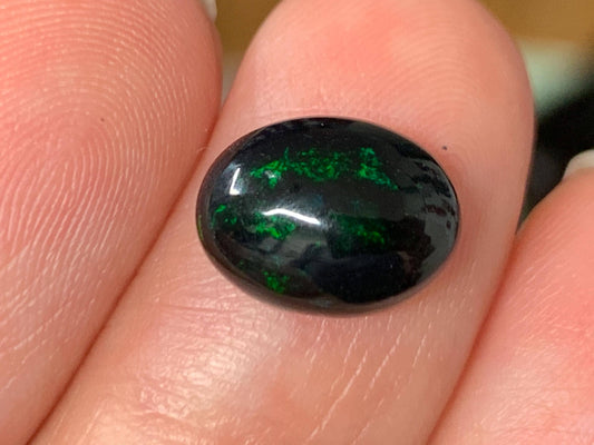 Natural Ethiopian Black Opal 8x11x4mm cabochon