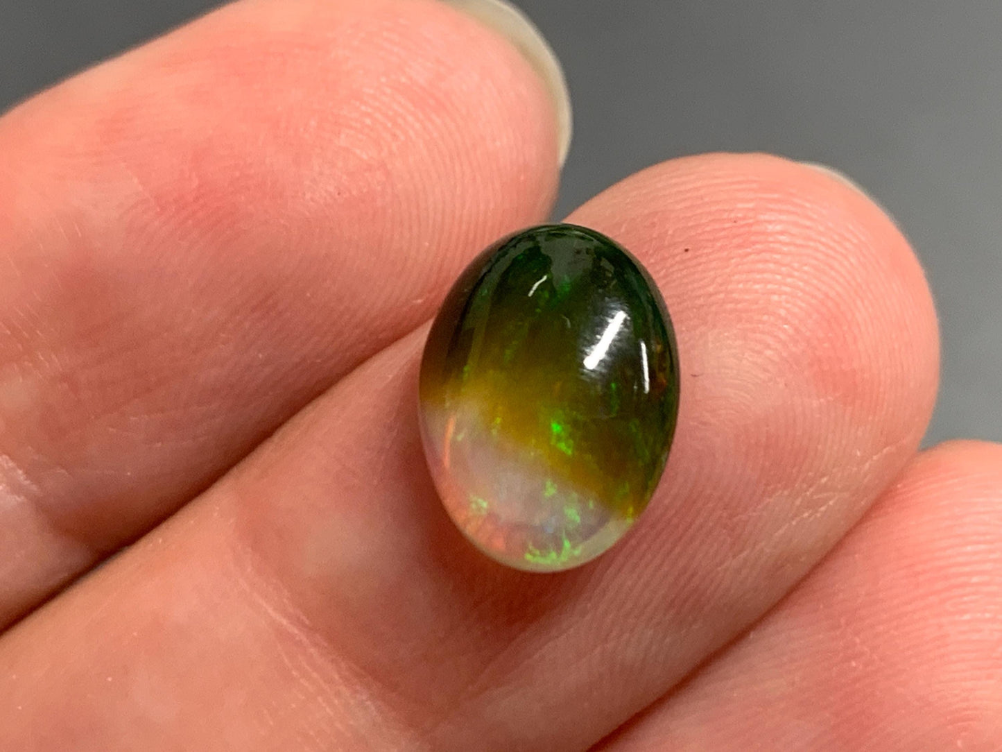 Natural Black Ethiopian Opal oval 9x11x4mm cabochon