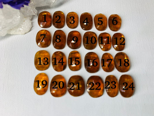 Faceted Orange Kyanite oval 10-11mm cabochon