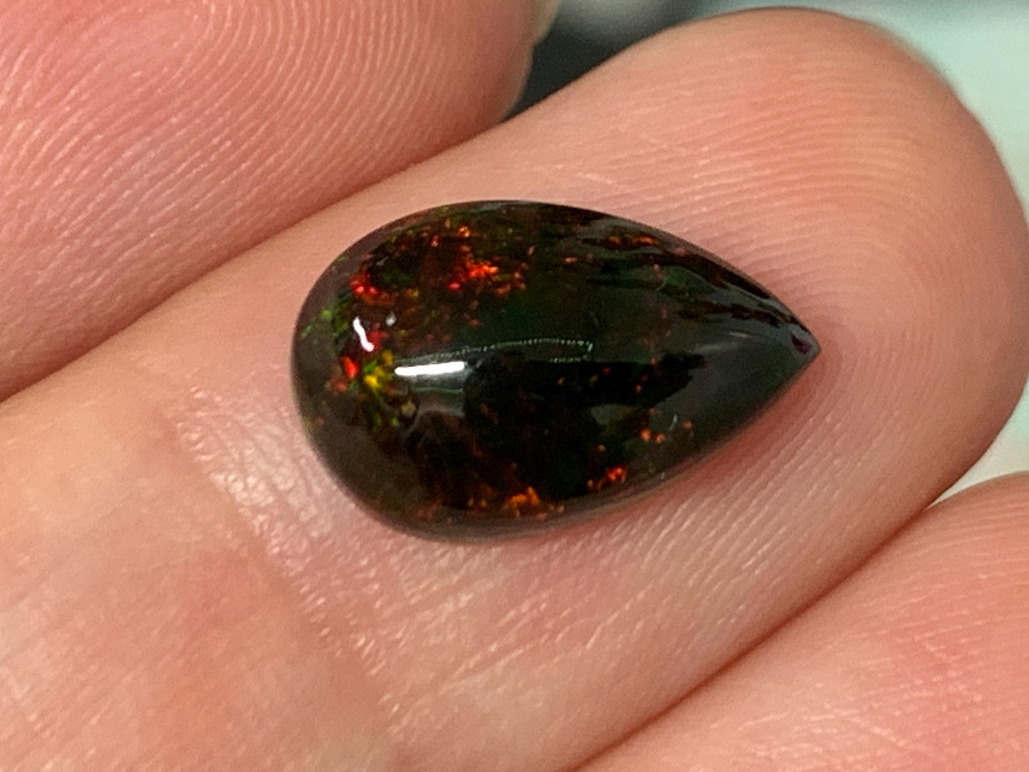 Natural Ethiopian Black Opal 8x12x4mm cabochon