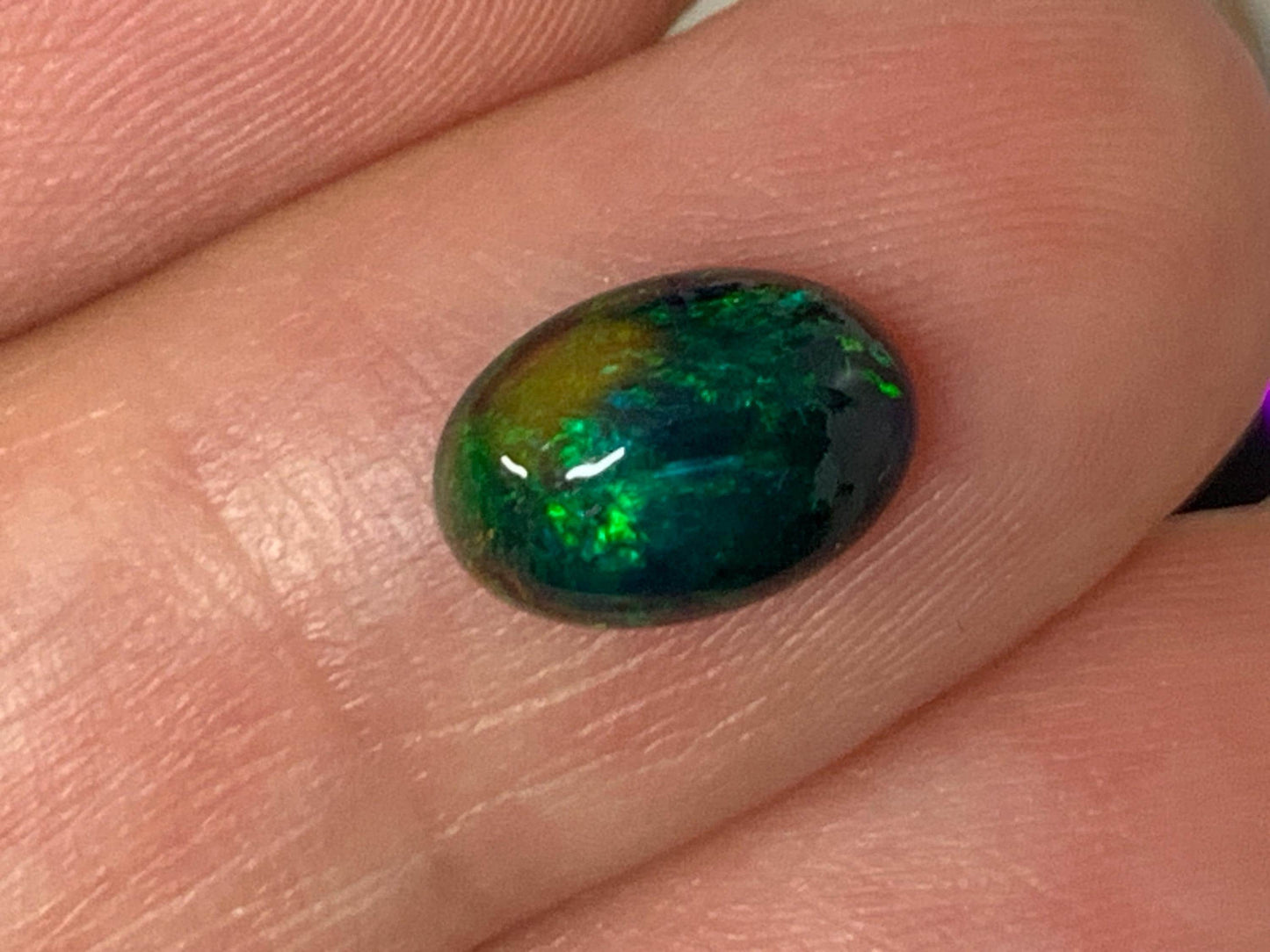 Natural Ethiopian Black Opal 6x9x3mm cabochon