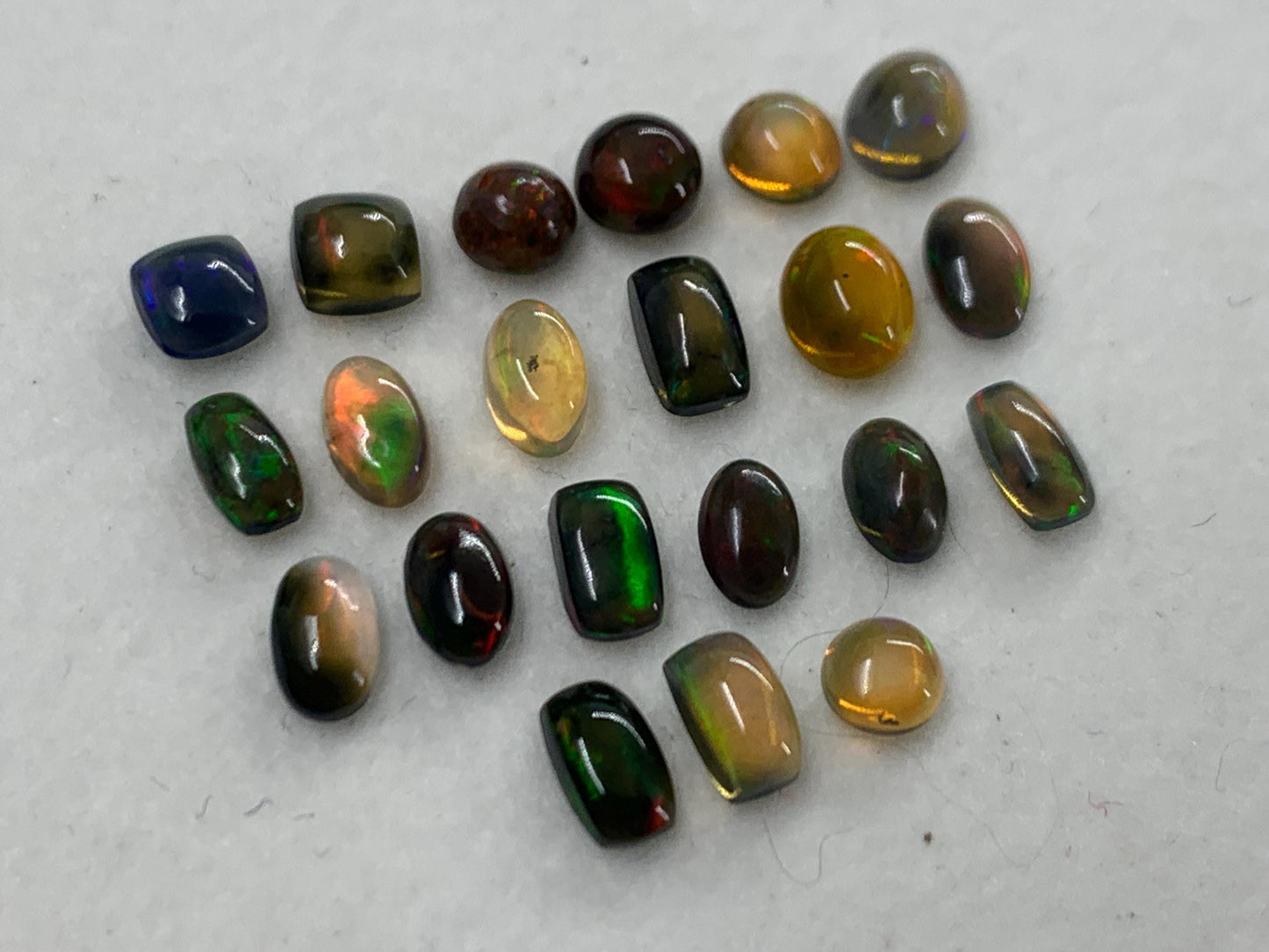 Natural Black Ethiopian Opal oval 4-5mm long cabochon *