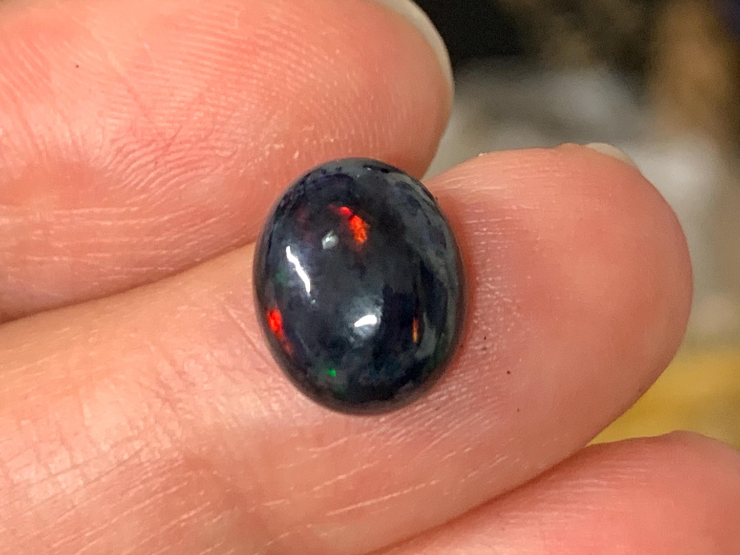 Natural Ethiopian Black Opal 9x11x5mm cabochon