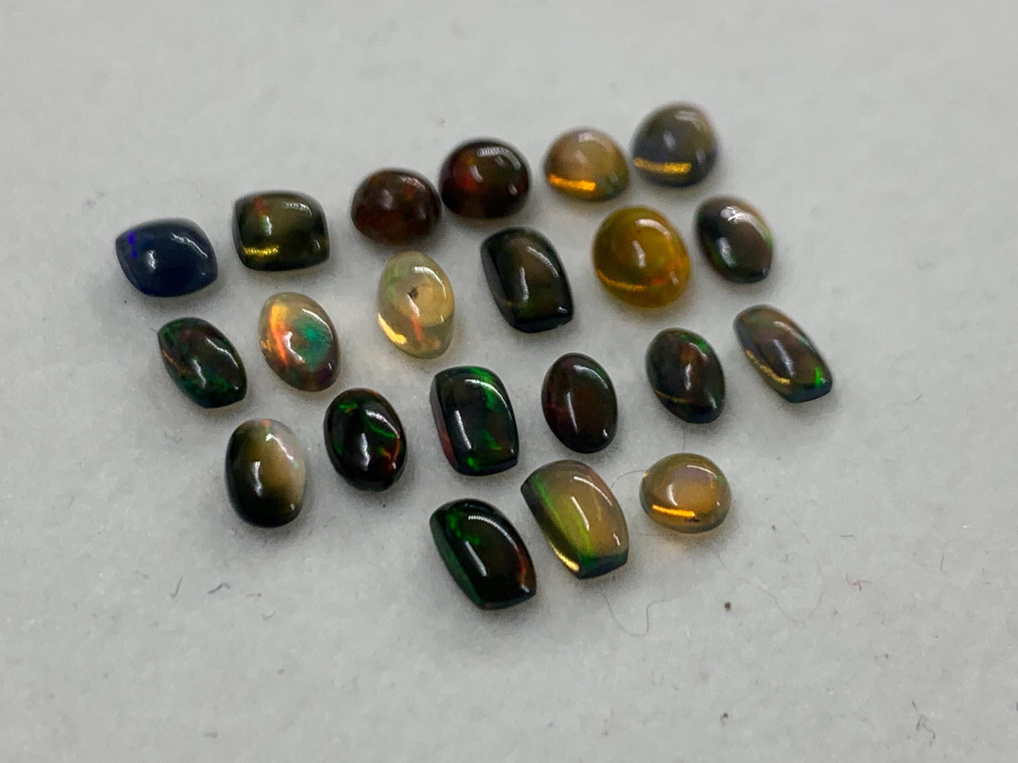 Natural Black Ethiopian Opal oval 4-5mm long cabochon *