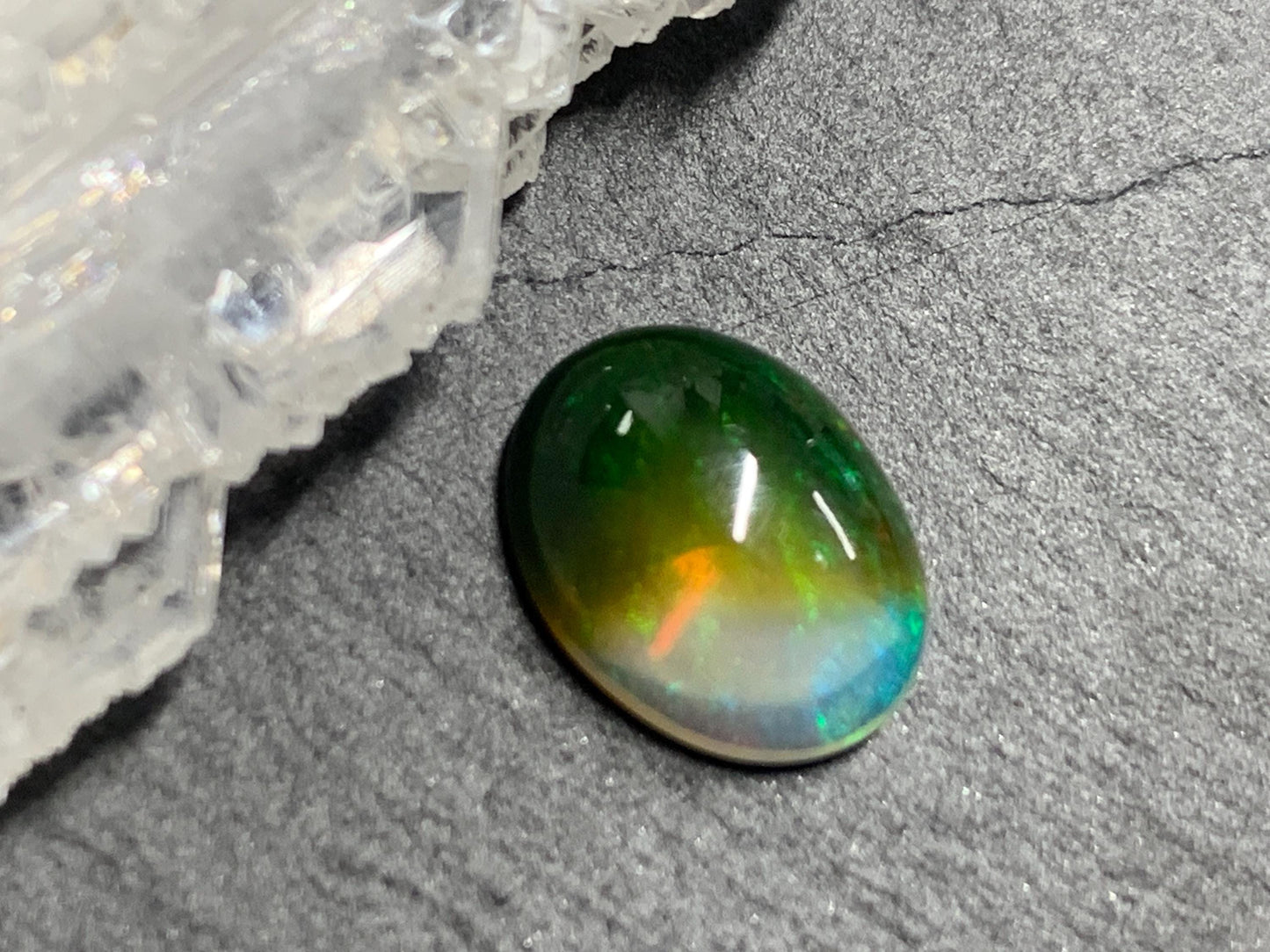 Natural Black Ethiopian Opal oval 9x11x4mm cabochon