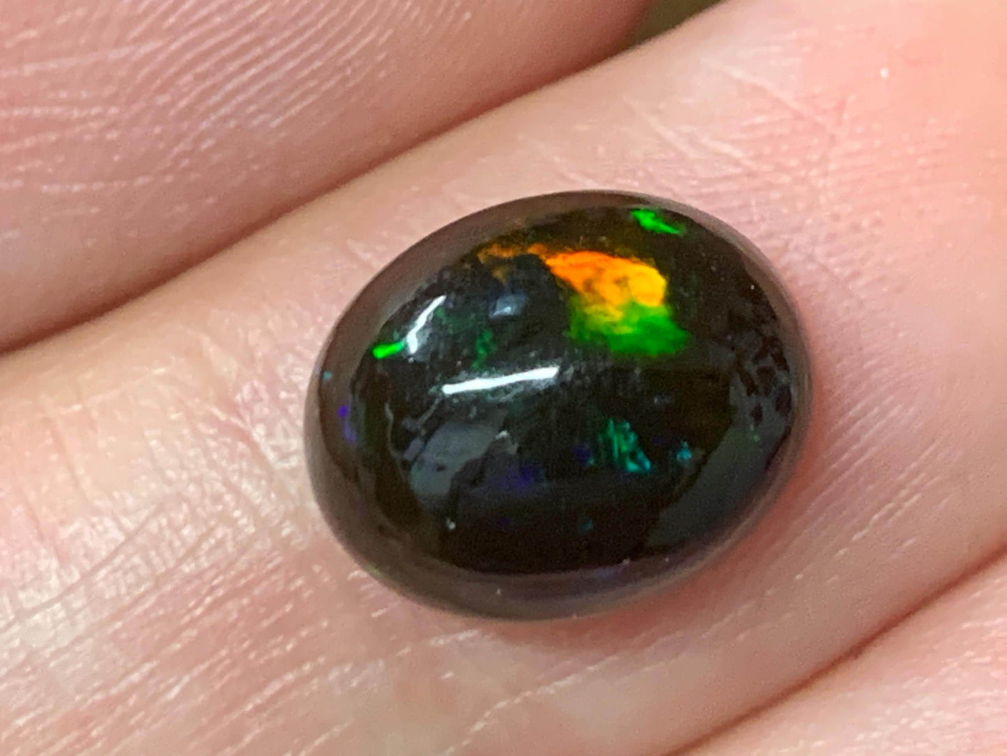 Natural Ethiopian Black Opal 9x11x5mm cabochon