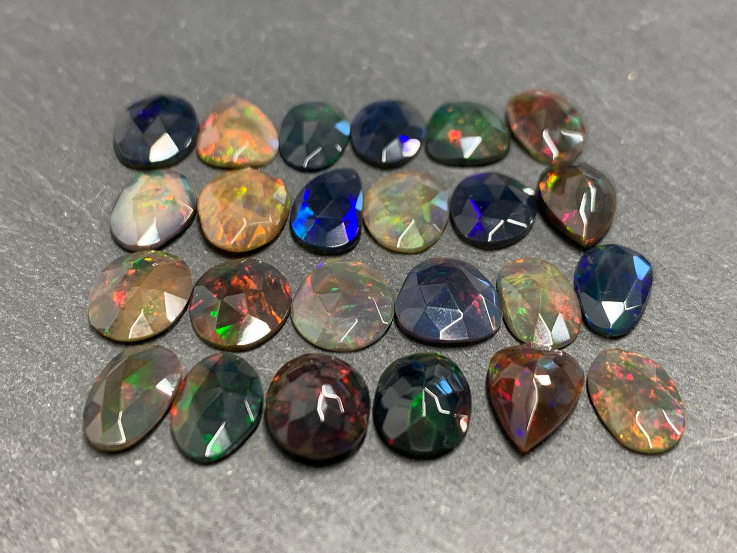 Faceted Black Ethiopian Opal 10-11mm long cabochon