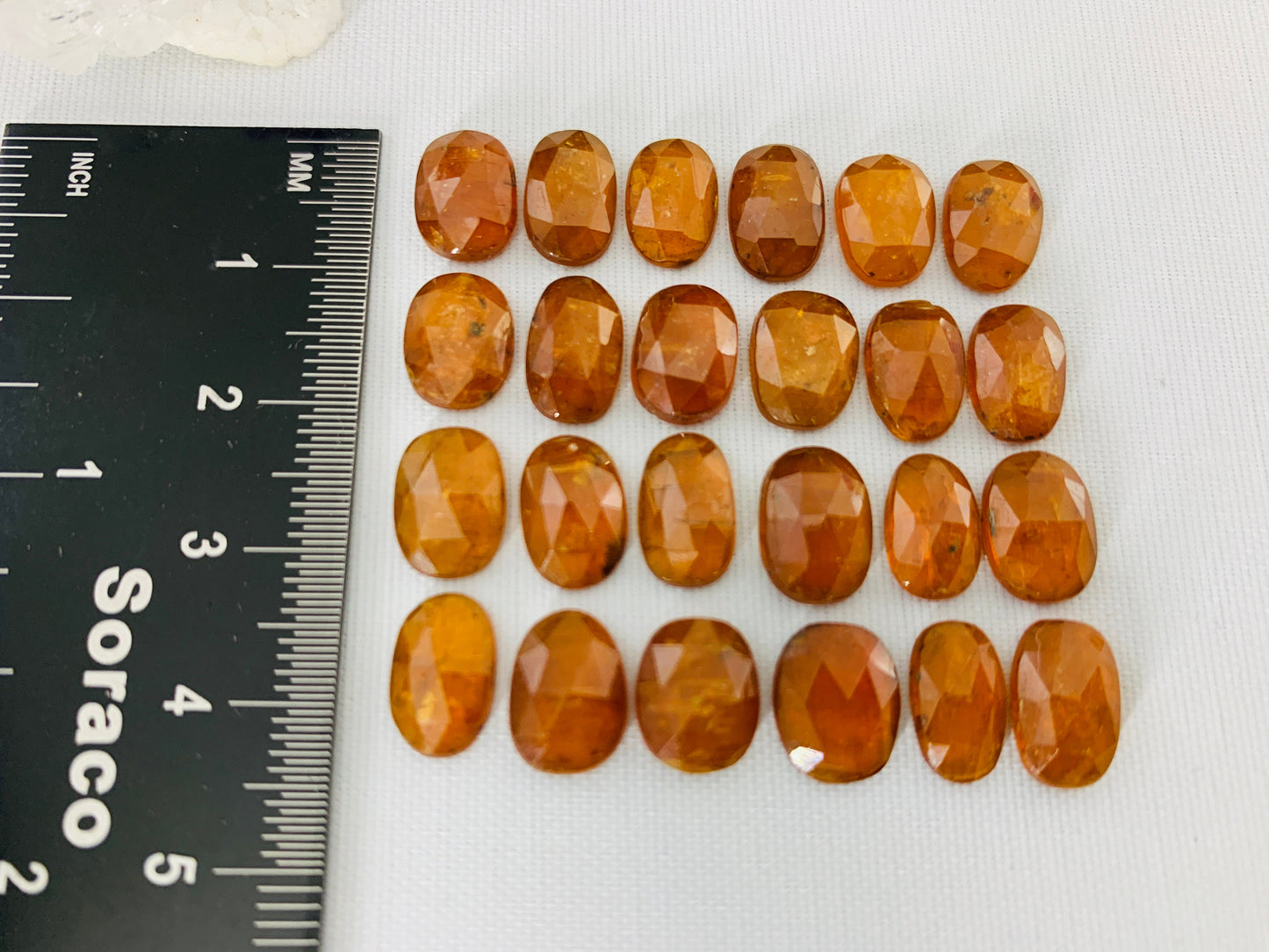 Faceted Orange Kyanite oval 10-11mm cabochon