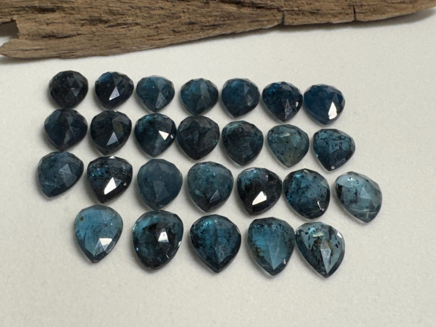 Faceted Moss Kyanite pear 10x14mm cabochon