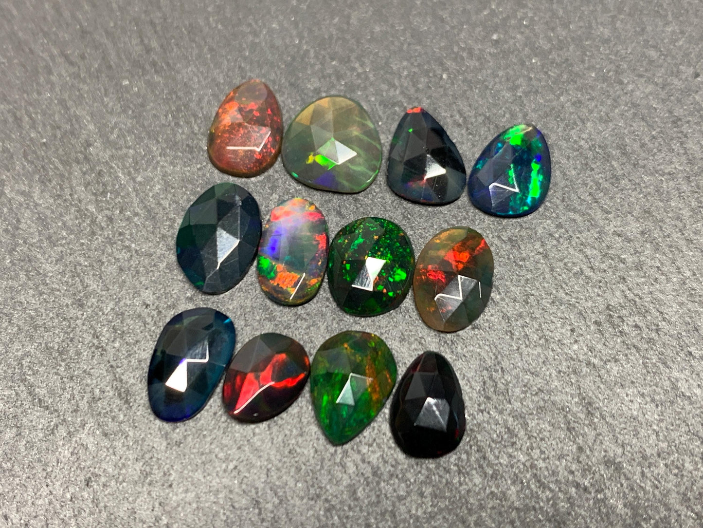 Faceted Black Opal free form 7-9mm long cabochon