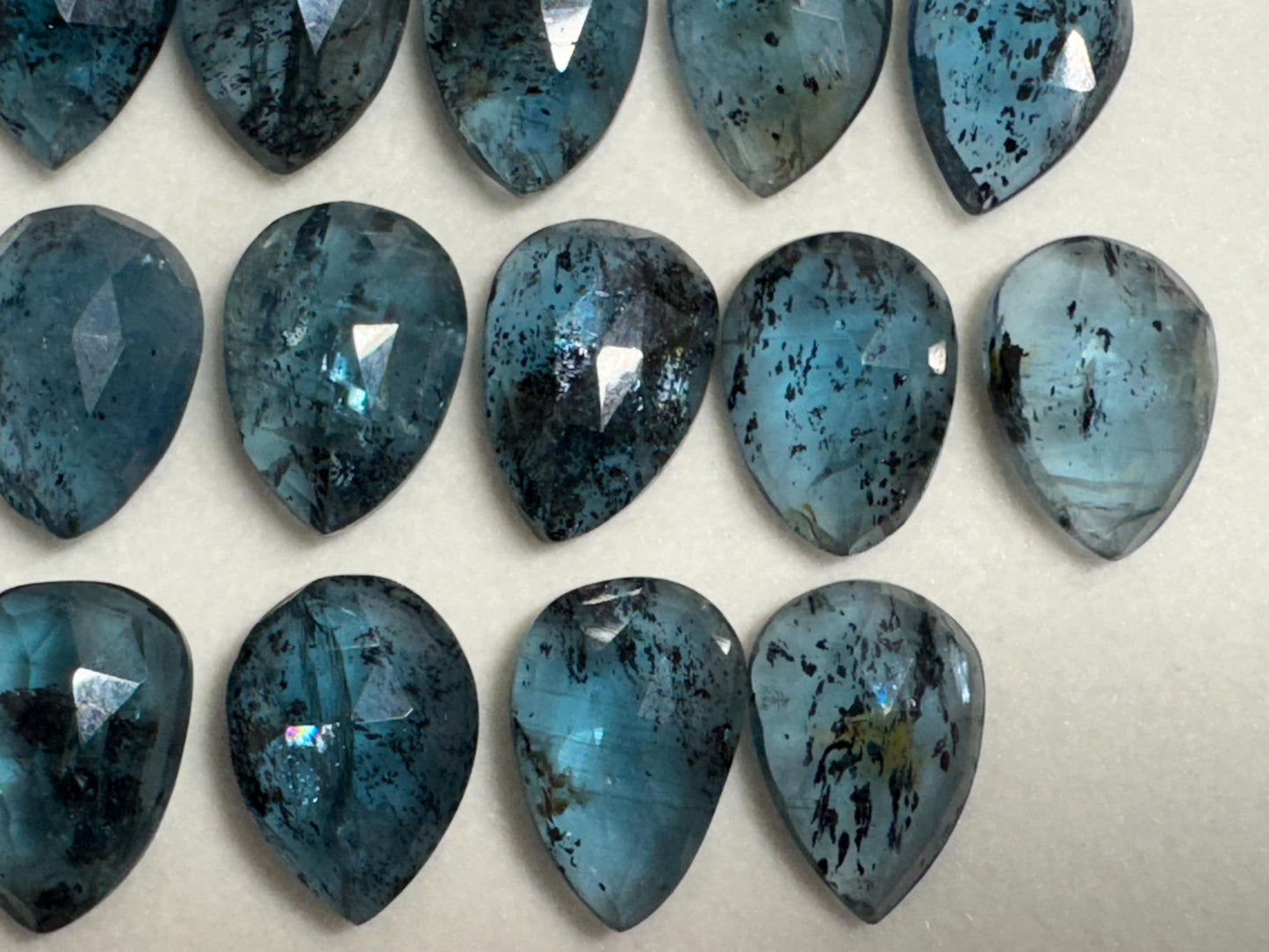 Faceted Moss Kyanite pear 10x14mm cabochon