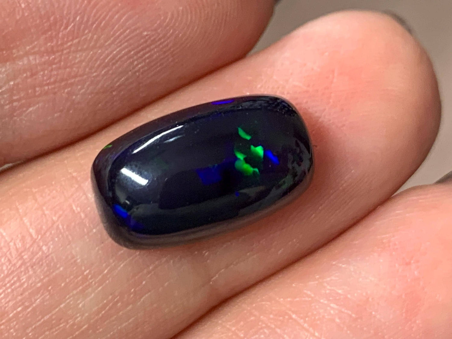 Natural Ethiopian Black Opal 8x14x5mm cabochon