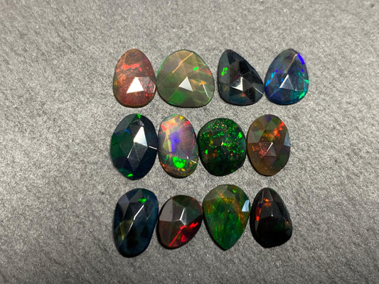 Faceted Black Opal free form 7-9mm long cabochon