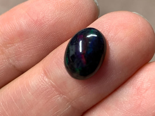 Black Ethiopian Opal oval 8x11x5mm cabochon