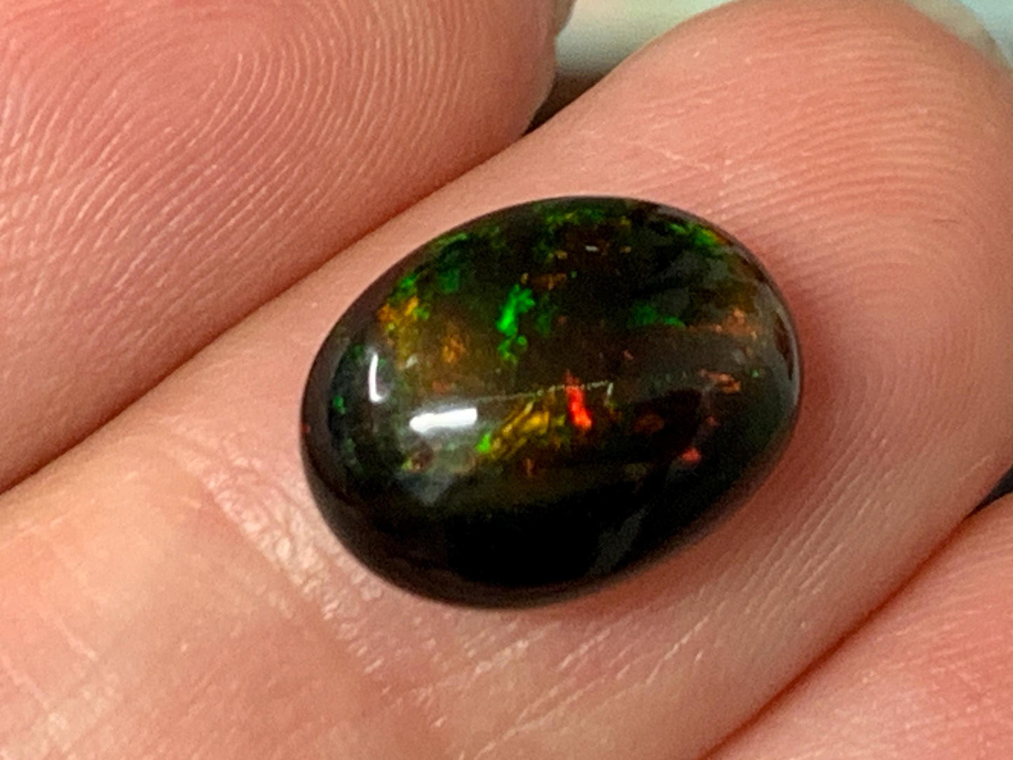 Natural Ethiopian Black Opal 9x12x5mm cabochon
