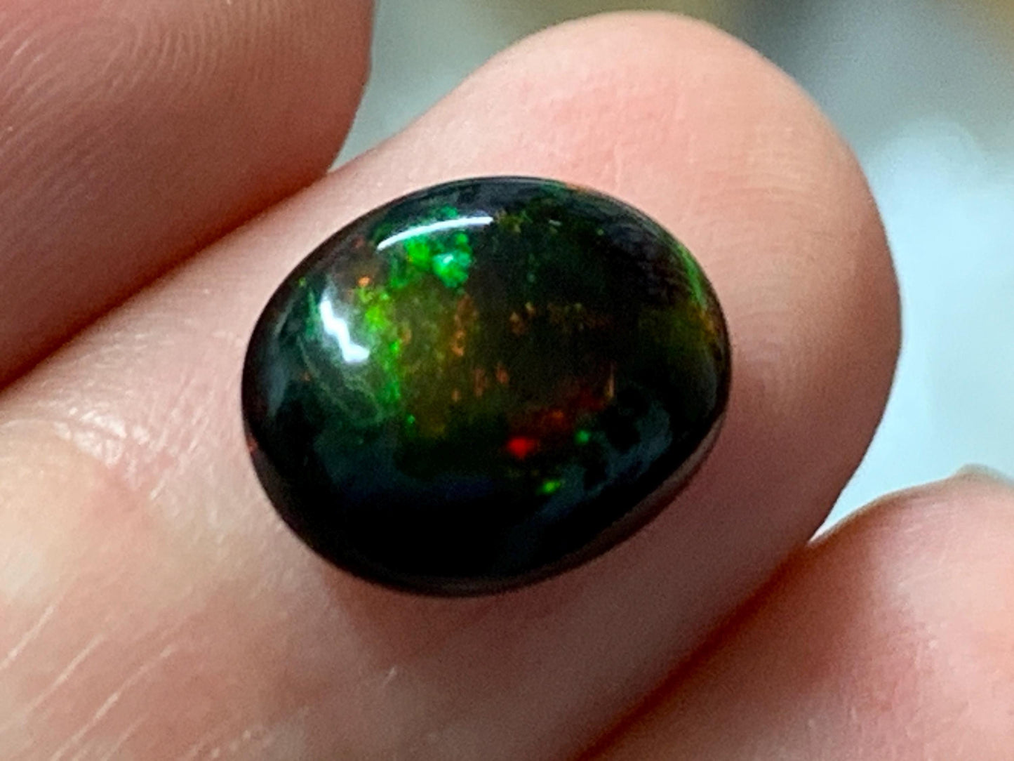 Natural Ethiopian Black Opal 9x12x5mm cabochon