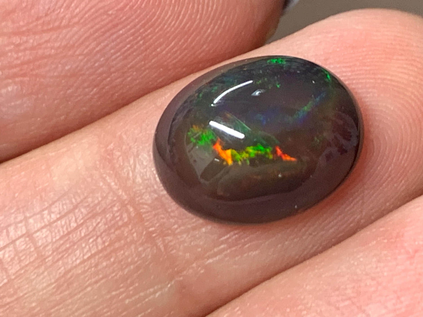 Natural Ethiopian Black Opal 10x13x5mm cabochon