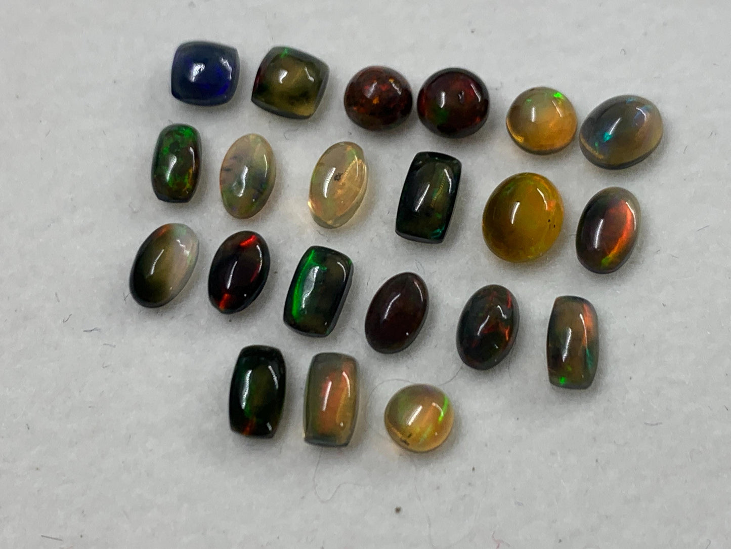 Natural Black Ethiopian Opal oval 4-5mm long cabochon *
