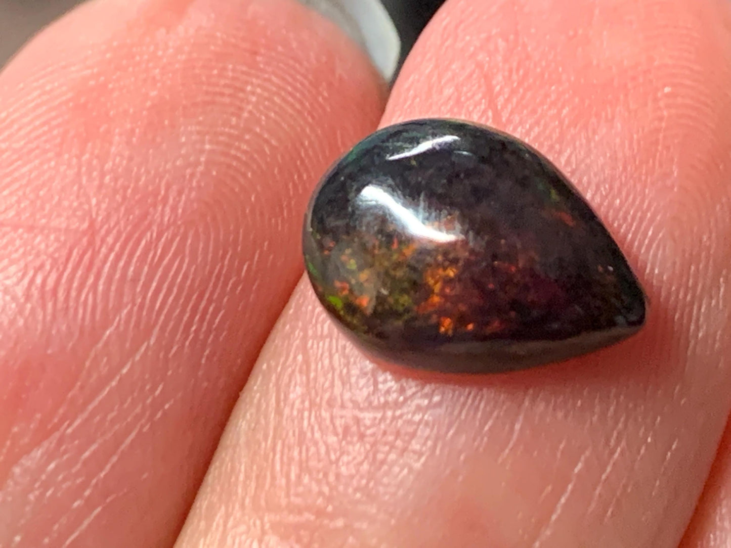 Natural Ethiopian Black Opal 8x11x4mm cabochon