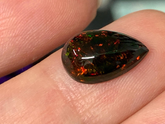 Natural Ethiopian Black Opal 8x12x4mm cabochon