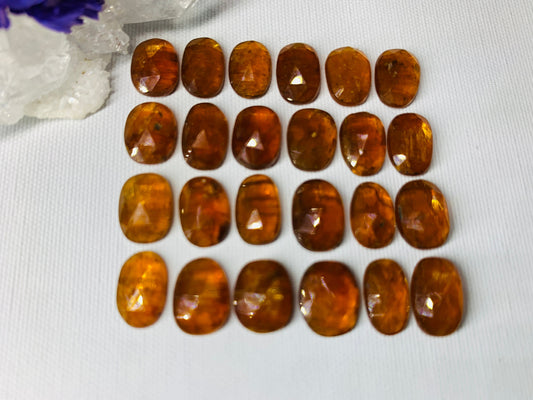 Faceted Orange Kyanite oval 10-11mm cabochon