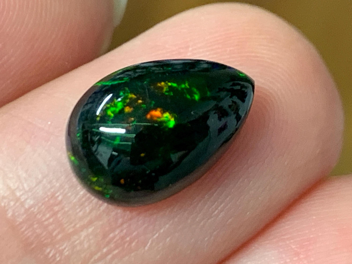Natural Ethiopian Black Opal 8x12x4mm cabochon