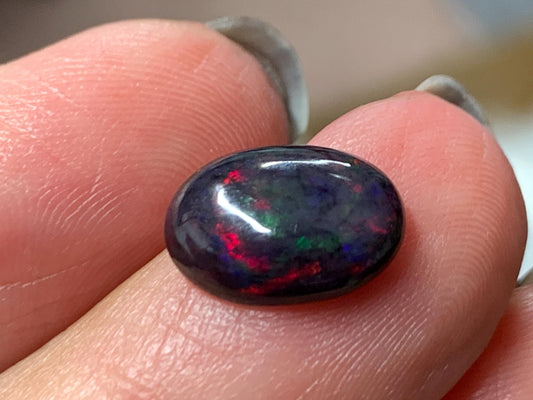 Natural Ethiopian Black Opal 9x11x5mm cabochon