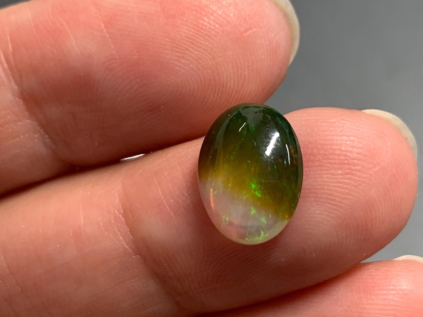 Natural Black Ethiopian Opal oval 9x11x4mm cabochon