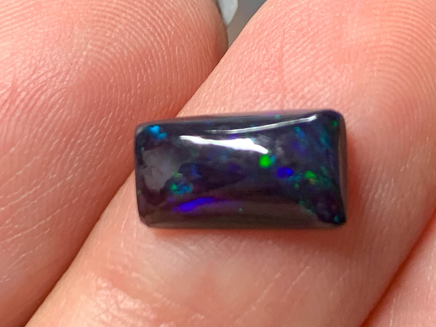 Natural Ethiopian Black Opal 6x11x3mm cabochon