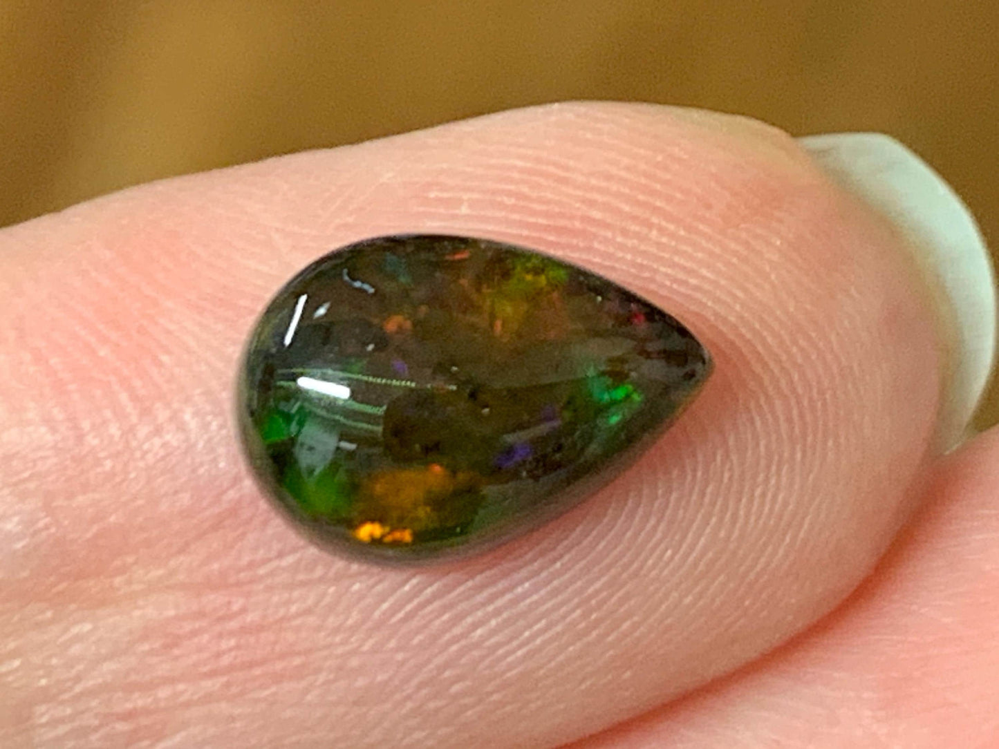 Natural Ethiopian Black Opal 7x11x3.5mm cabochon