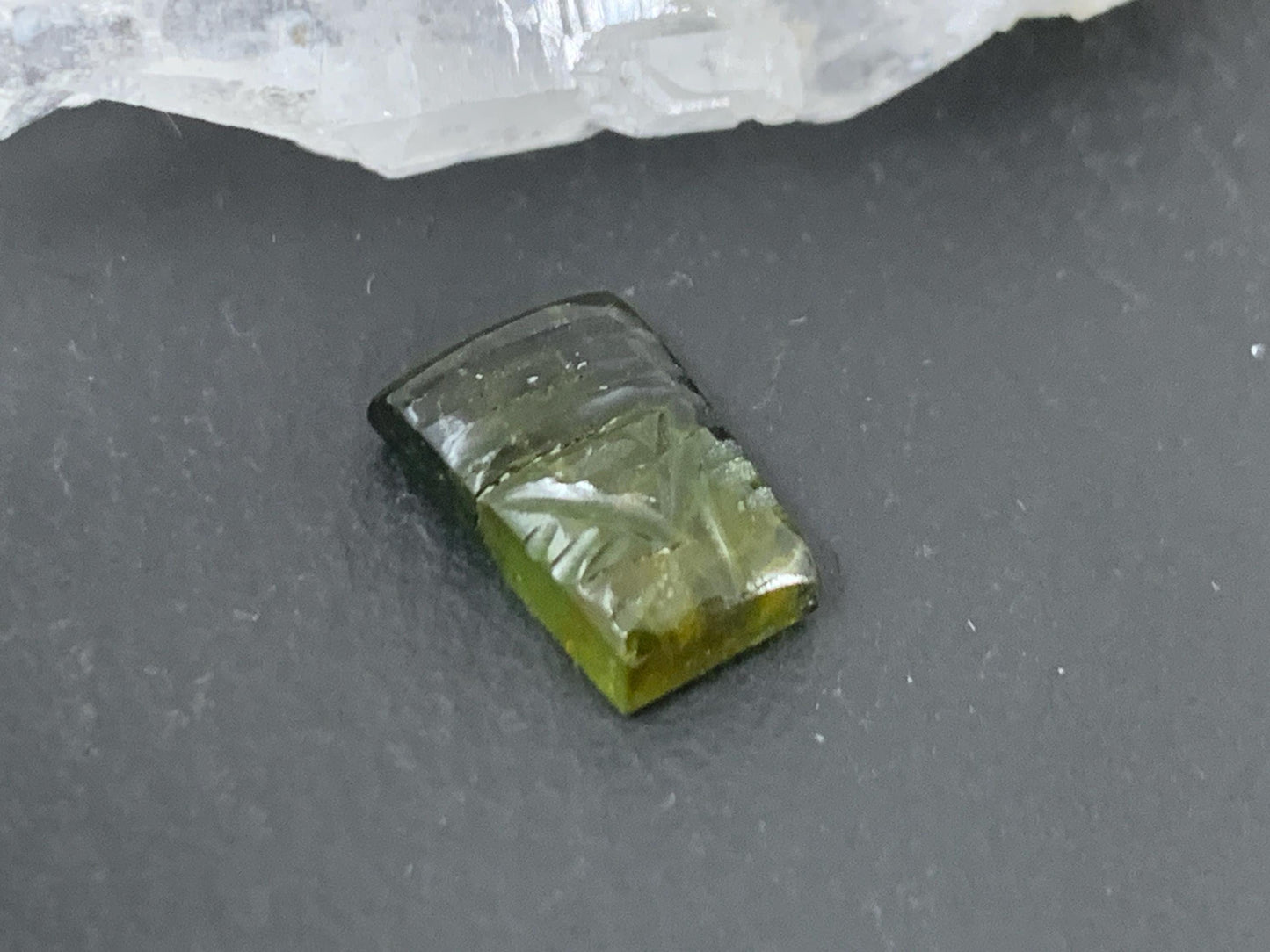 Carved Tourmaline 7x10x3mm cabochon