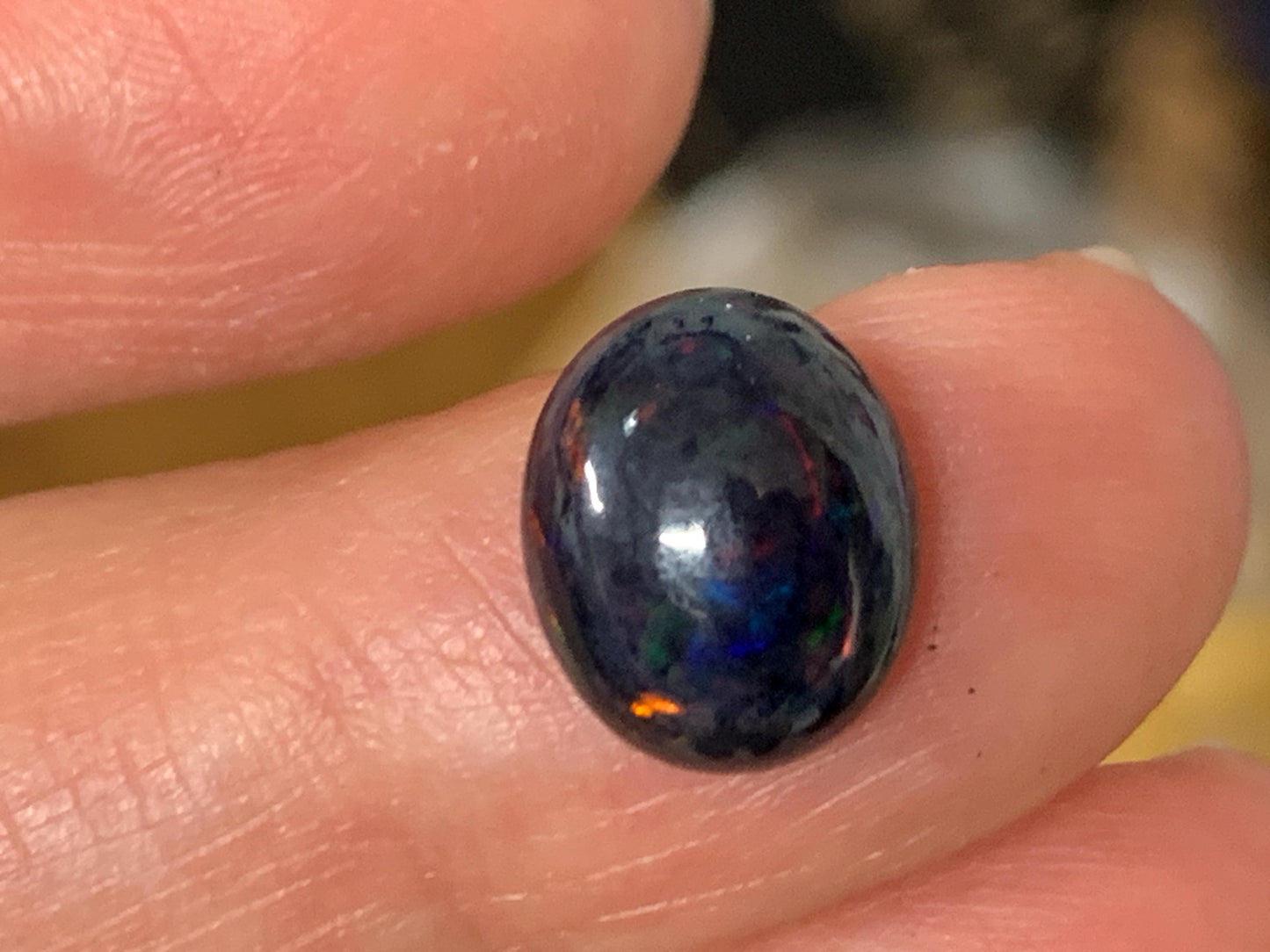 Natural Ethiopian Black Opal 9x11x5mm cabochon