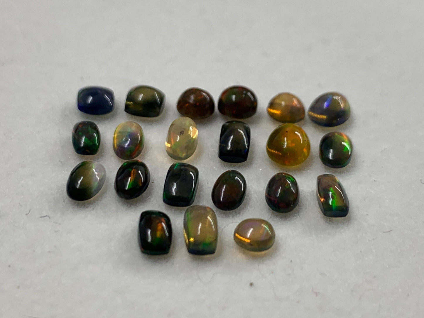 Natural Black Ethiopian Opal oval 4-5mm long cabochon *