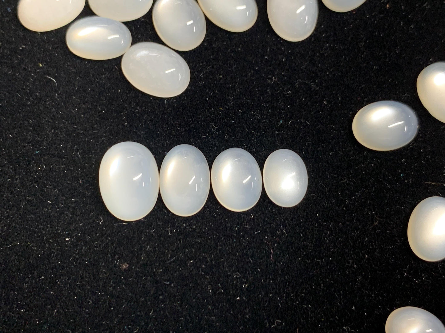 White Moonstone oval 8-11mm long cabochon