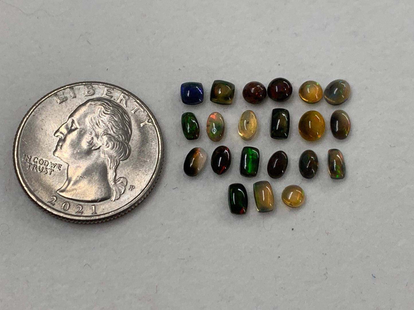 Natural Black Ethiopian Opal oval 4-5mm long cabochon *