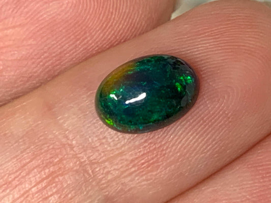Natural Ethiopian Black Opal 6x9x3mm cabochon