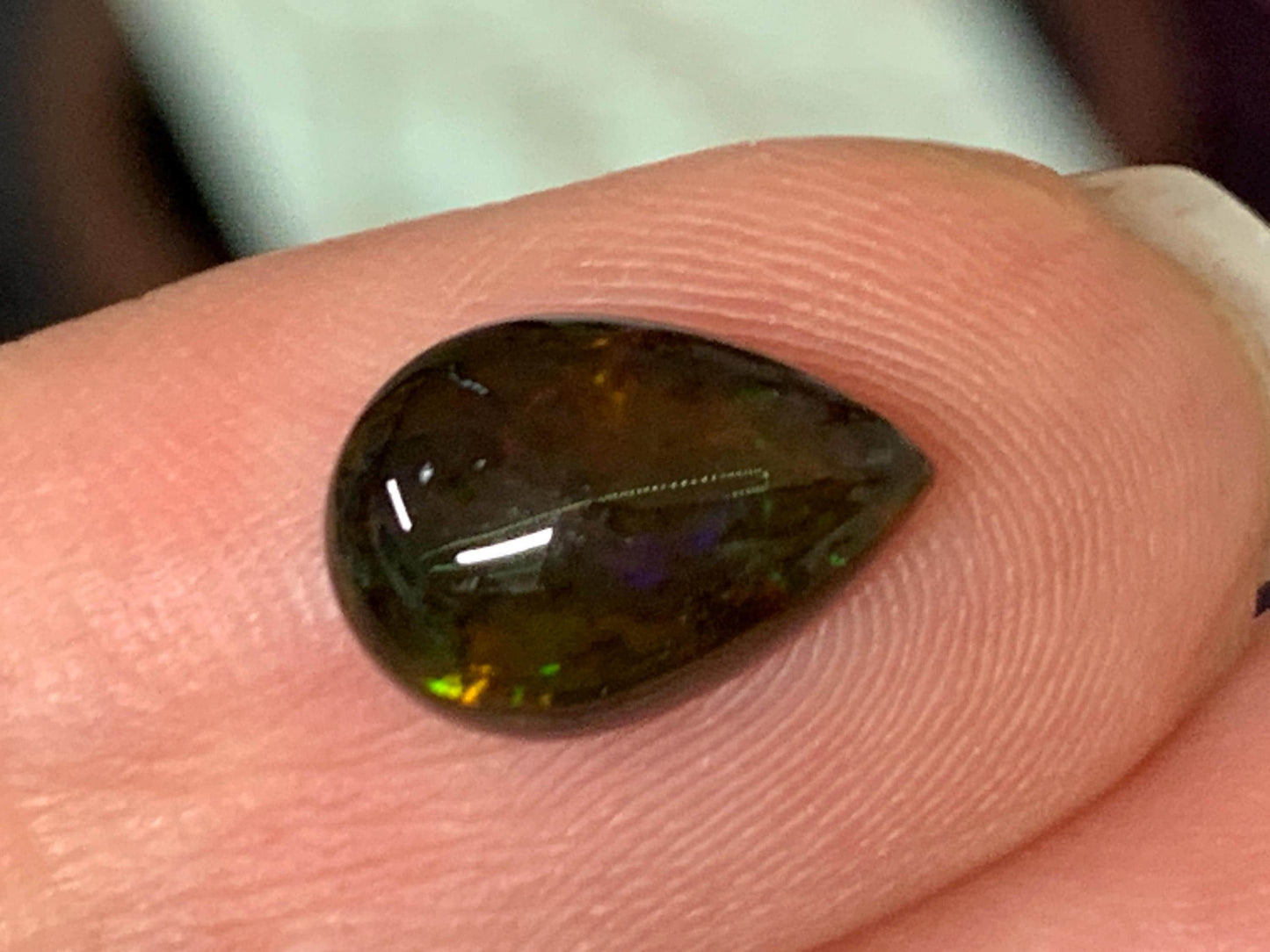 Natural Ethiopian Black Opal 7x11x3.5mm cabochon