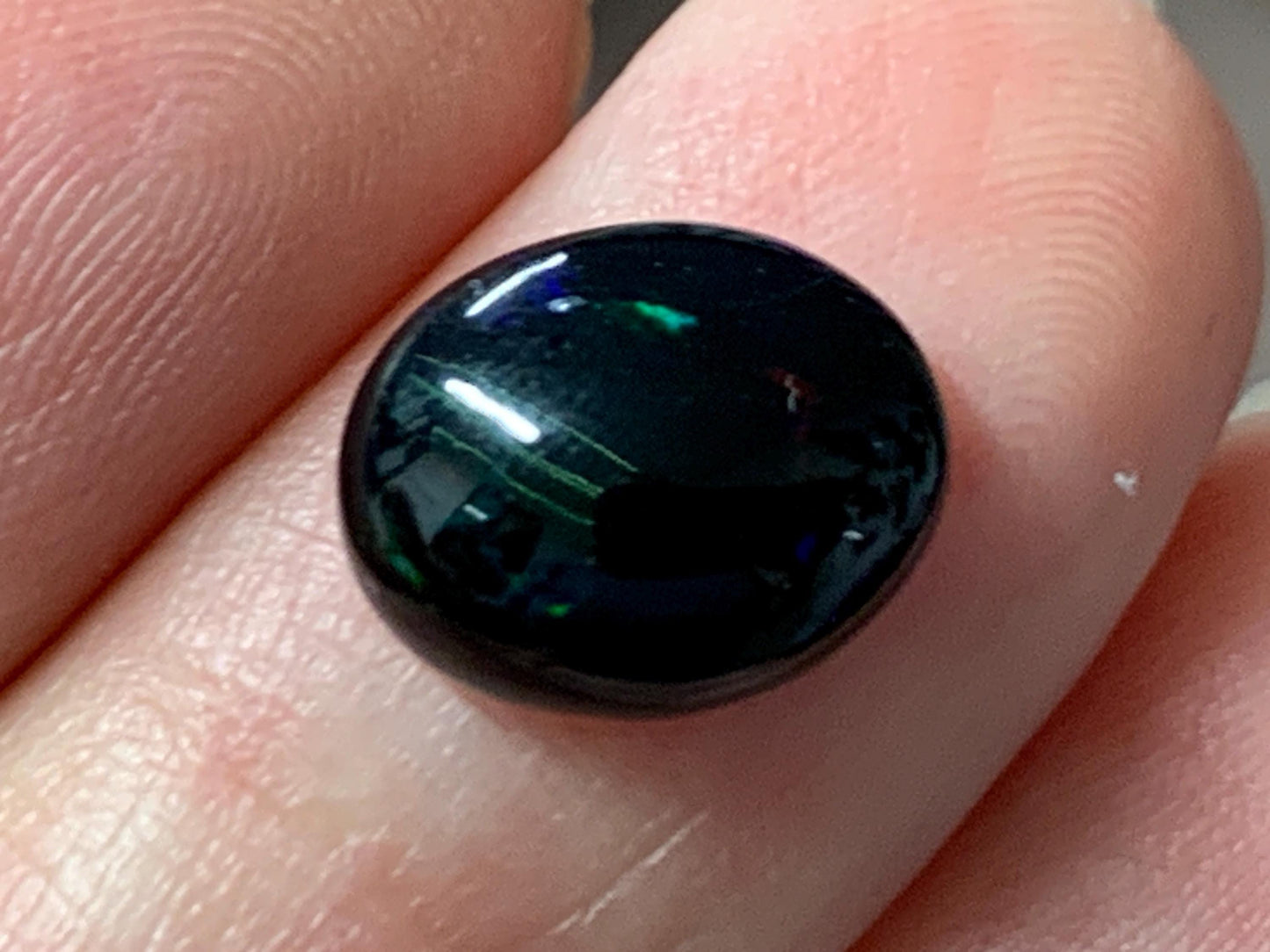 Natural Ethiopian Black Opal 9x11x4mm cabochon