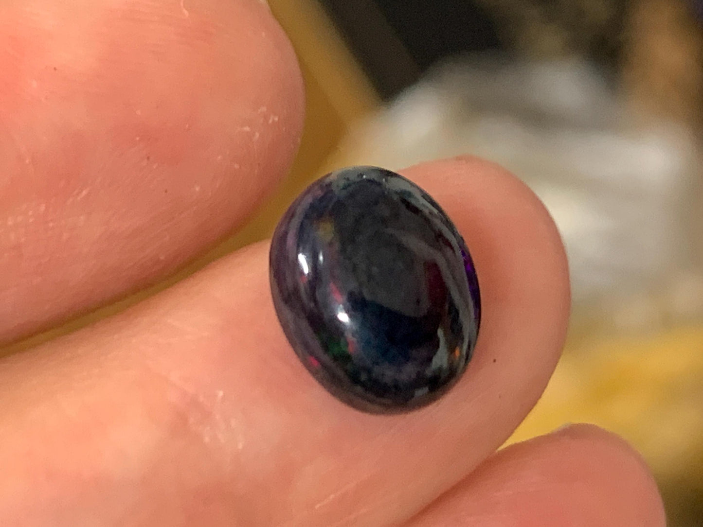 Natural Ethiopian Black Opal 9x11x5mm cabochon