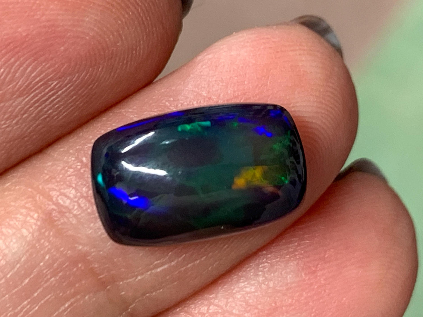 Natural Ethiopian Black Opal 9x14x5mm cabochon