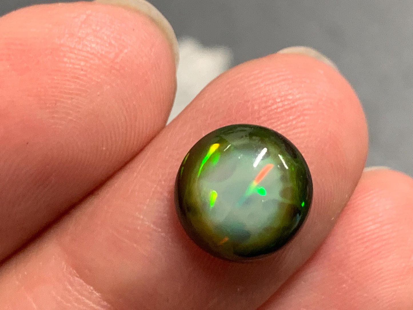 Natural Black Ethiopian Opal round 9.5x9.5x4mm cabochon
