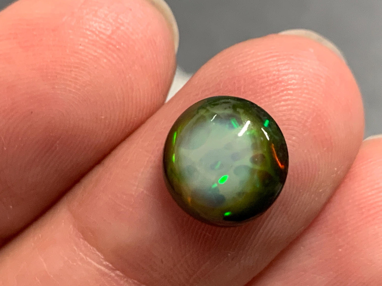 Natural Black Ethiopian Opal round 9.5x9.5x4mm cabochon
