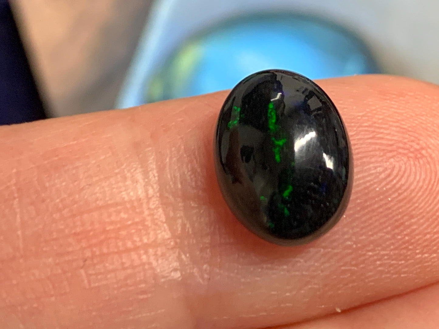 Natural Ethiopian Black Opal 8x11x4mm cabochon
