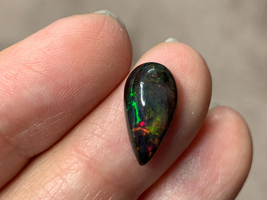 Black Ethiopian Opal pear 7x14x4mm cabochon