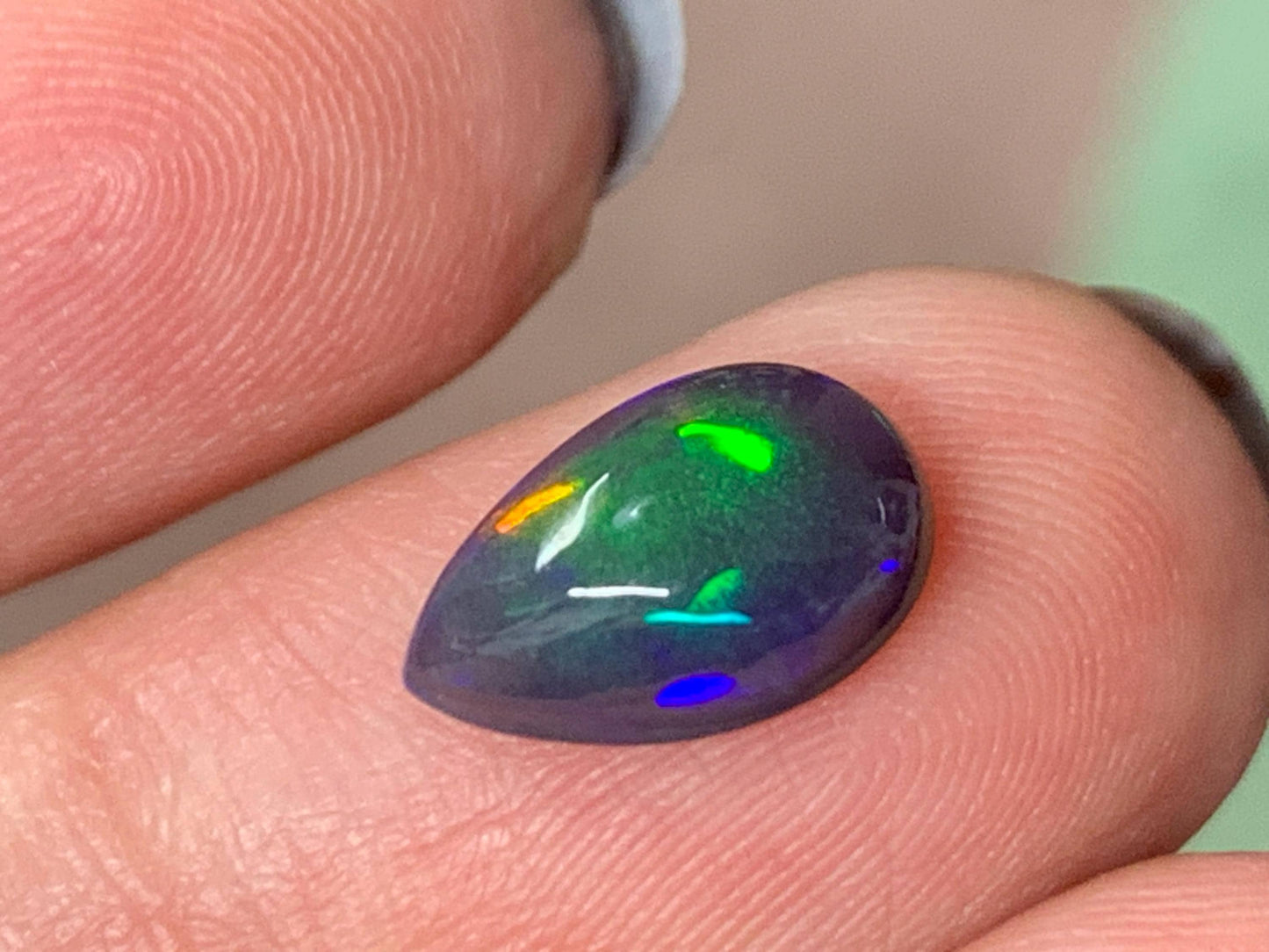 Natural Ethiopian Black Opal 7x11x4mm cabochon