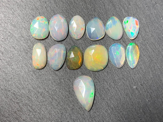 Faceted Ethiopian Opal 11-16mm long cabochon